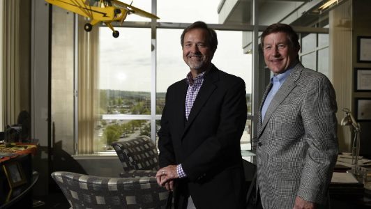 CEO Jay Jolley, left, and president Burt Odom are photographed in the offices of the EMJ Corporation in Chattanooga, Tenn.